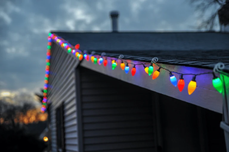 Safe outdoor holiday lighting installation on Florida home by electricians